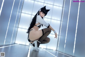 A woman in a cat costume posing for a picture.