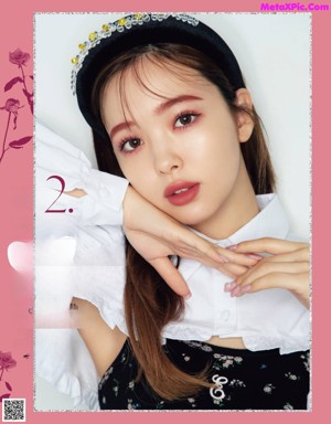 A magazine with a picture of a woman with makeup and cosmetics.