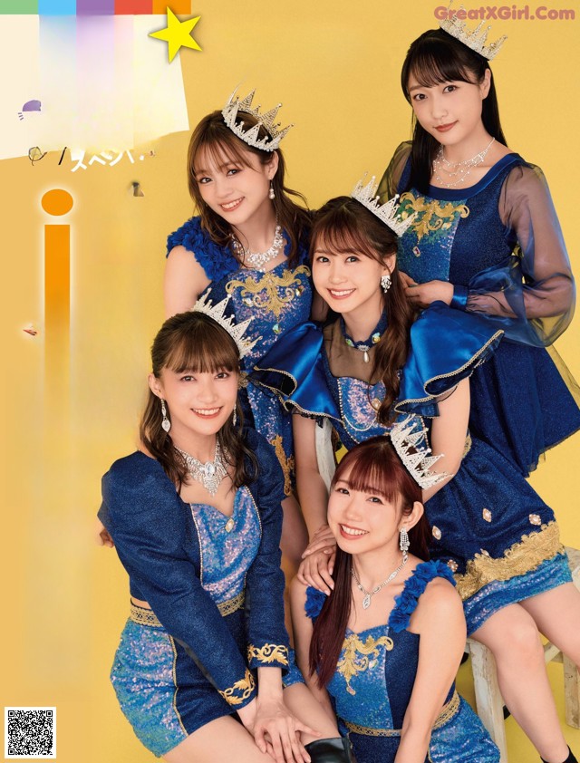 A group of young women wearing crowns pose for a picture.