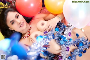 A woman in a party outfit is posing for the camera.