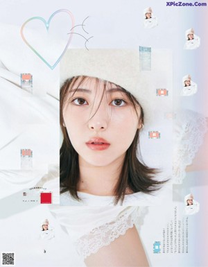 A woman in a white dress is posing for a magazine.